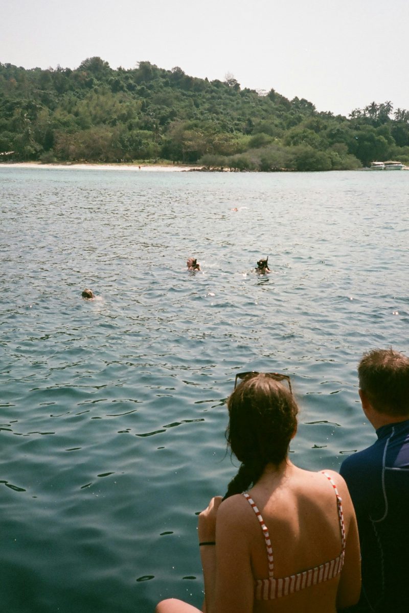 Guests snorkelling in clear water during a private speedboat tour around Koh Samui