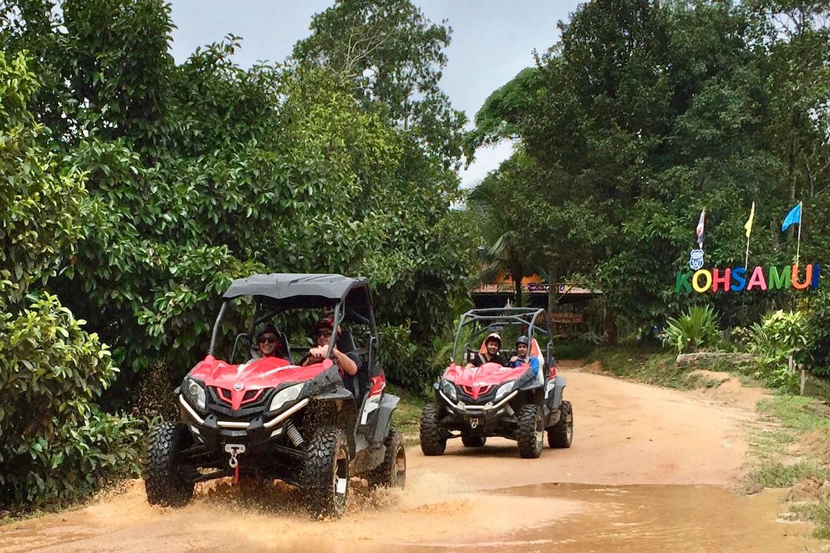 Quad biking fun in the jungles of Koh Samui with Paradise Travel and Tours. This picture has two buggies in a jungle landscape