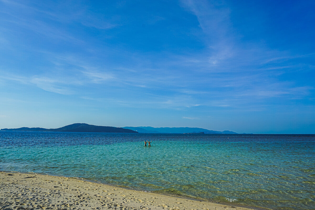 People in the crystal clear waters of Koh Samui