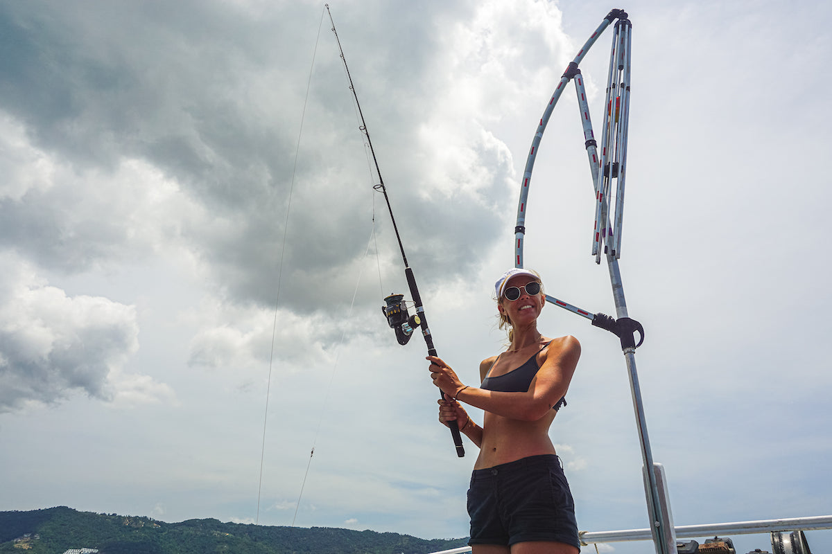 Smiling lady whilst on a private fishing charter