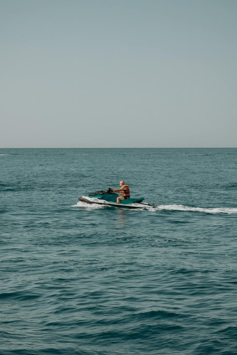 Person on a jet ski in the middle of a large body of water